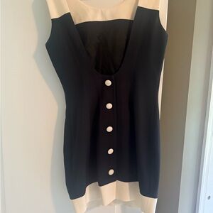 Super stylish, black and cream mini sleeveless dress.